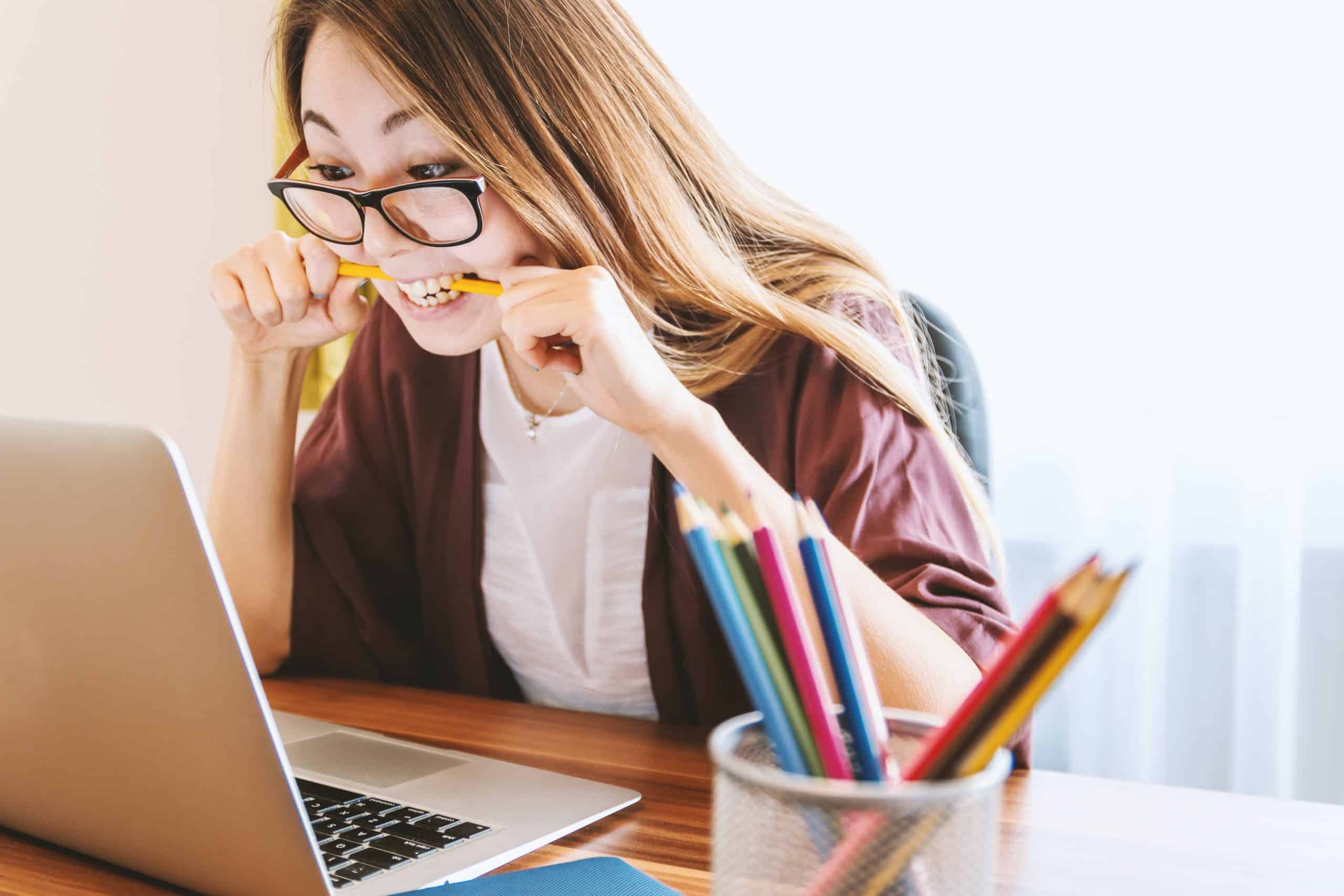 A IT Consultant breaks a pencil in half with her teeth while thinking about turning a job she hates into an opportunity for growth.